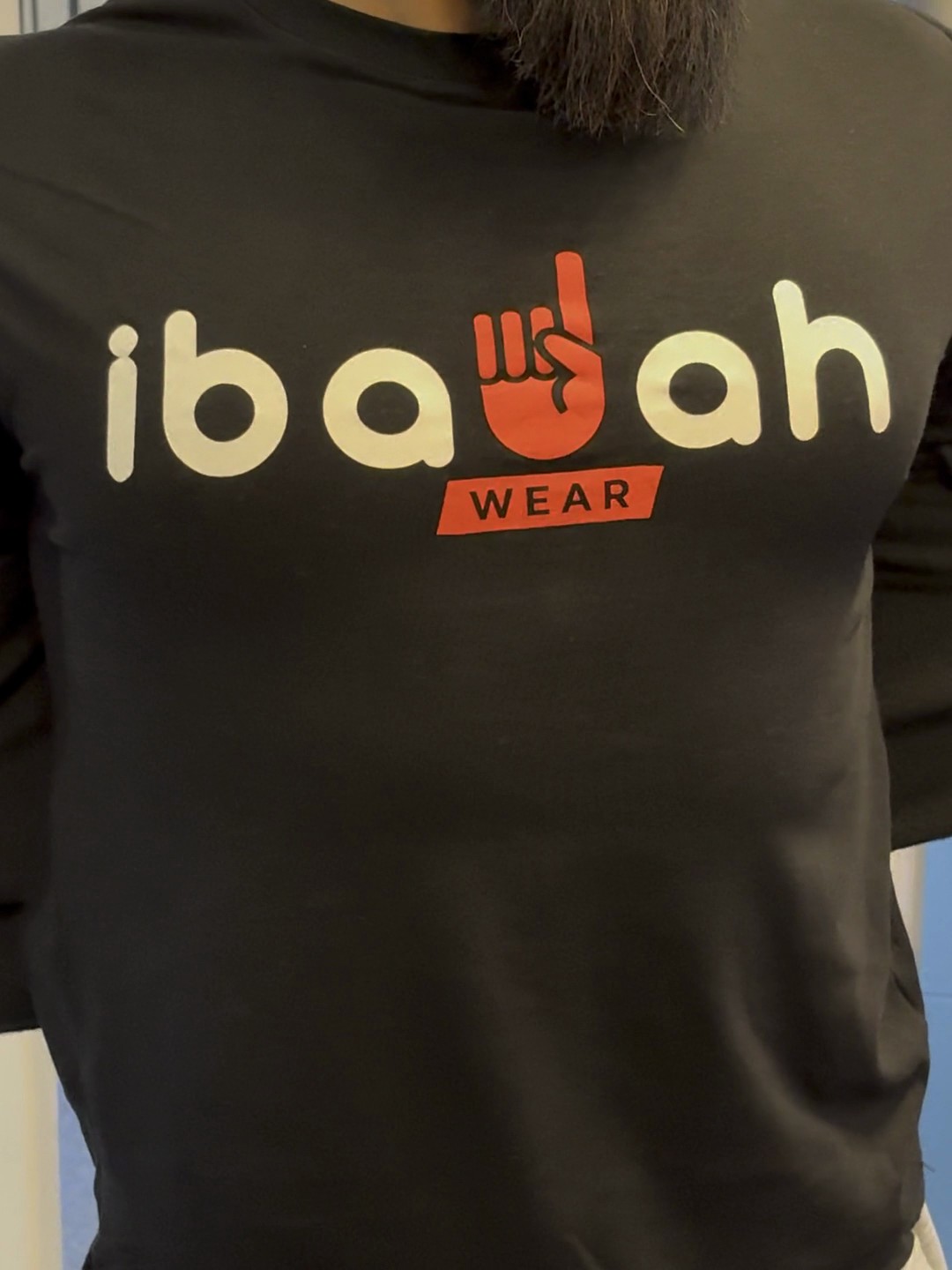 IbadahWear logo revealed on a black tee